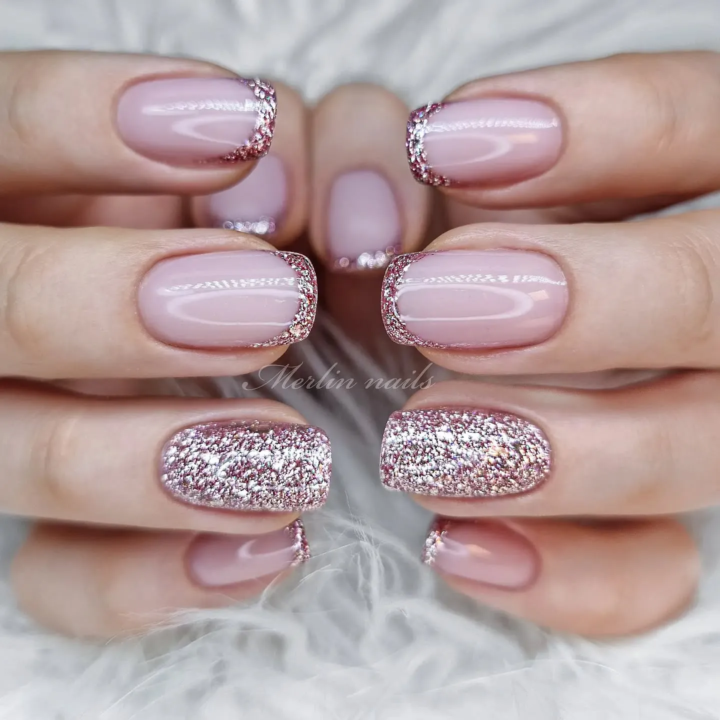 This blush pink French tip set adds a romantic twist with rose-gold glitter accents. A glossy nude-pink base keeps the look clean and classic, while fine glitter French tips bring just enough sparkle without overpowering the design. The full glitter accent nails tie everything together, making this set feel polished, feminine, and perfect for anyone who loves elegant sparkle.