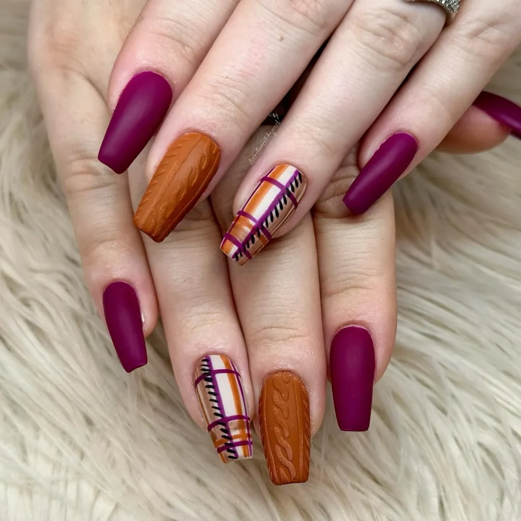 Matte burgundy meets sweater-textured orange and plaid accents in this chic, layered look. These nails capture everything we love about fall — rich color, cozy texture, and serious Thanksgiving nails inspiration.
