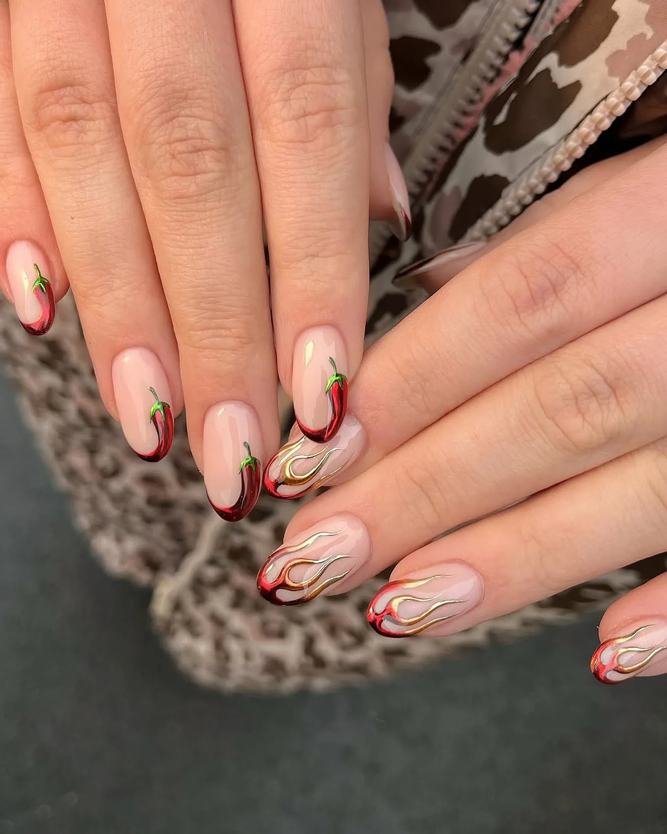 @inspire_nail_studio keeps it glam with deep red and gold flame French tips. It’s a dope nail art twist that works just as well for a night out as it does for everyday sparkle.