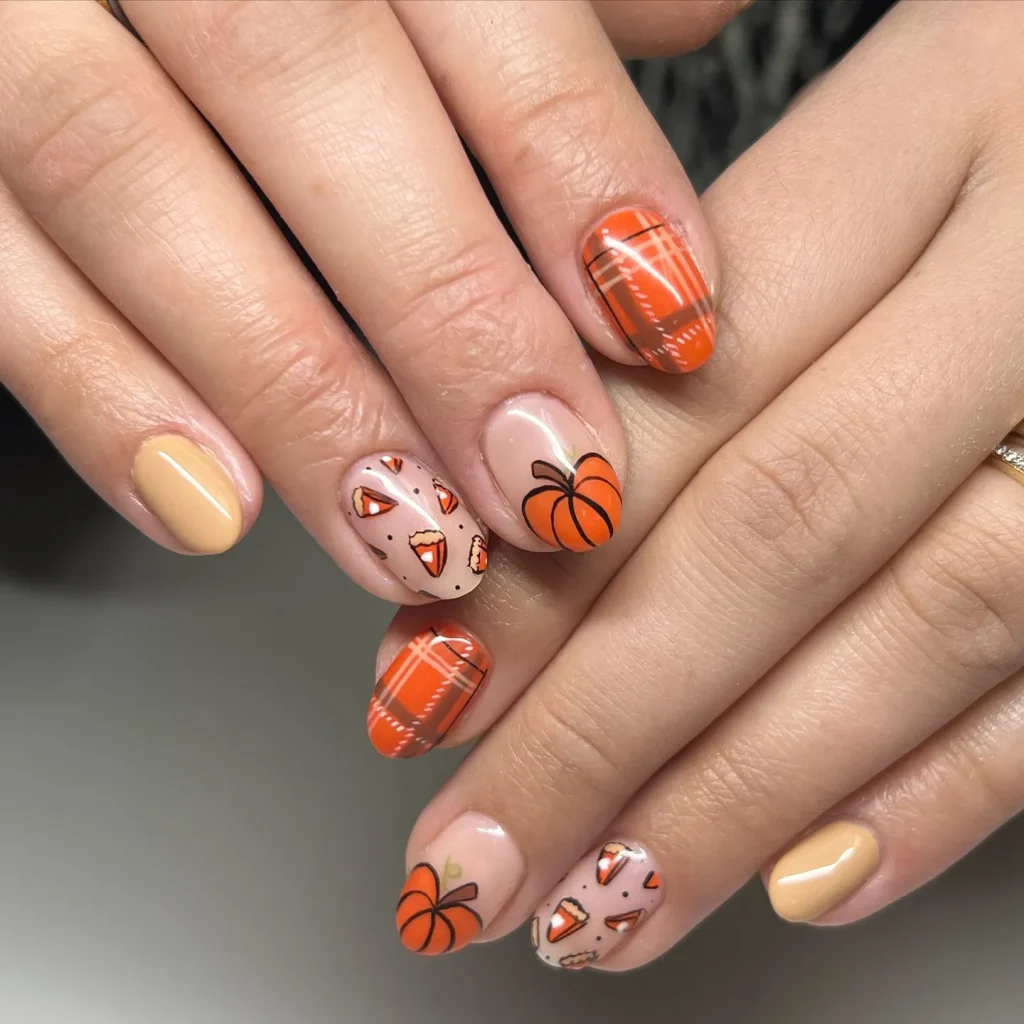 Pumpkin and candy corn accents paired with plaid nails? Yes, please. These cute November nails are the perfect mix of playful and pretty — a must-save design for anyone planning their Thanksgiving mani.
