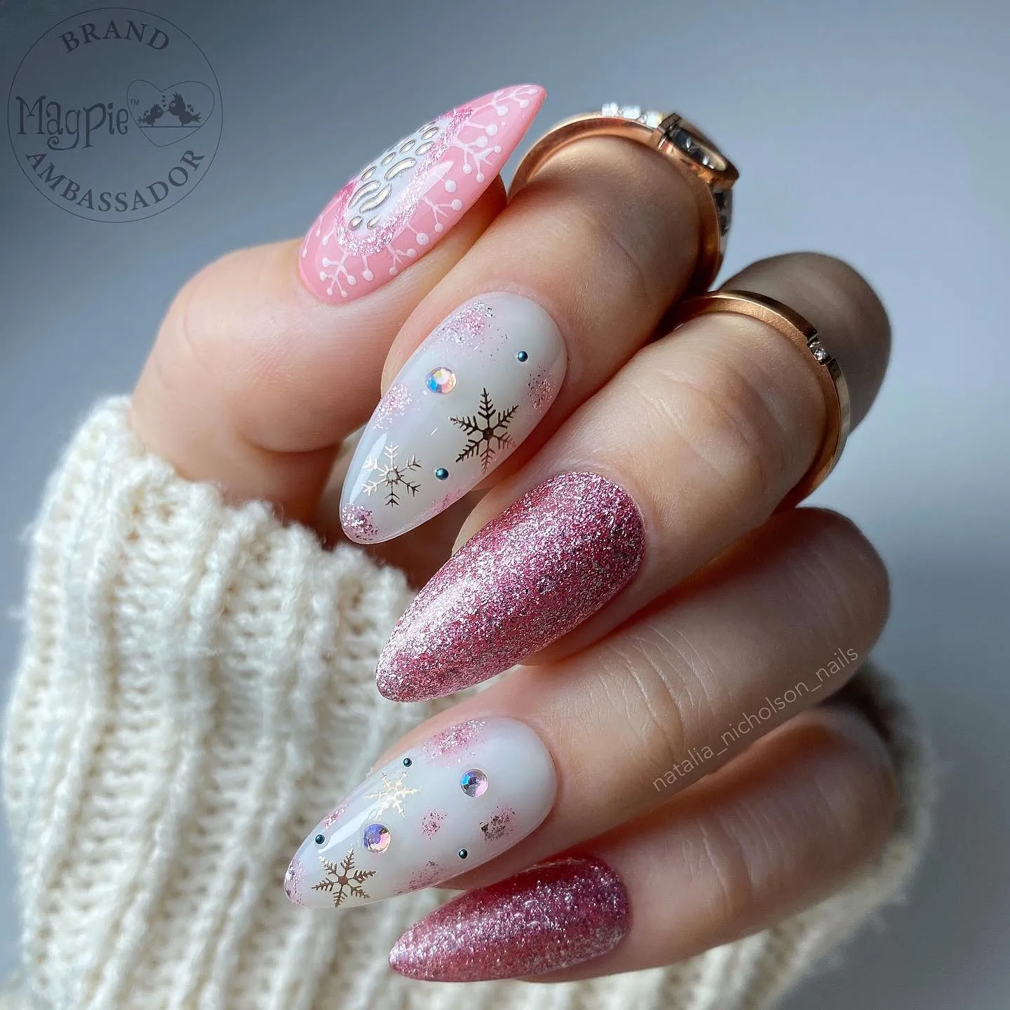 These glittery pink snowflake nails are pure pink Xmas nail perfection. With sparkly ombré, rhinestone details, and a frosted finish, they’re the ideal choice for anyone who loves pretty winter nails that shine bright all season.