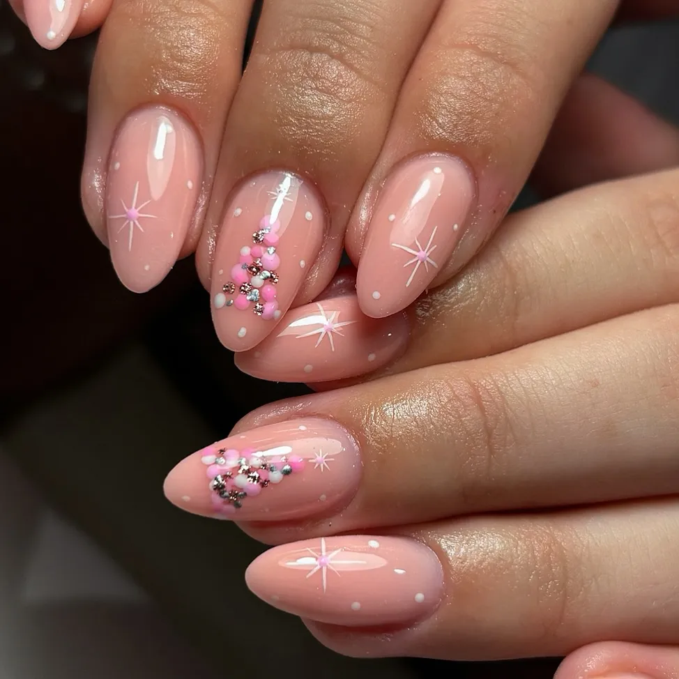 Soft blush pink, delicate stars, and sparkly gems — this manicure is giving Baby Pink Christmas Nails energy. It’s subtle, feminine, and ideal for pink holiday nails that feel festive without being over the top.