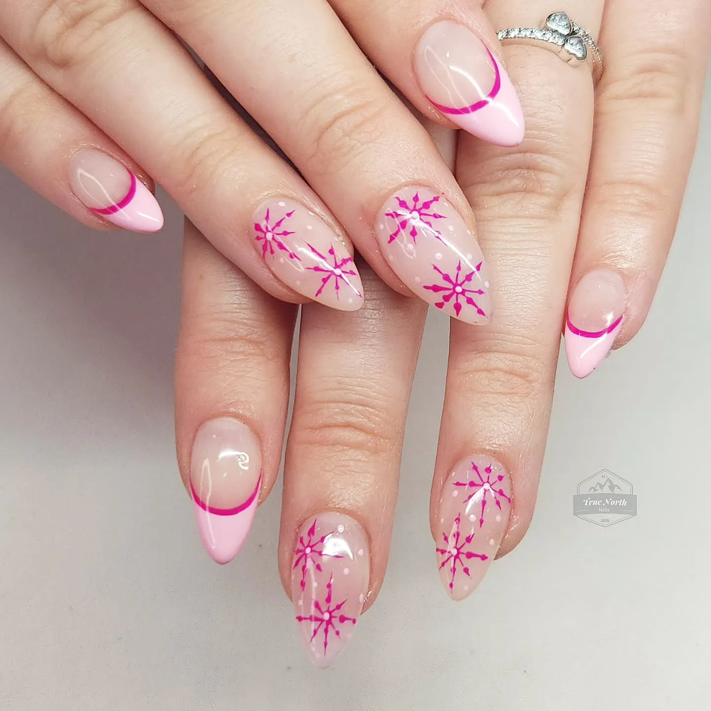 These Pink Winter Nails keep it simple and stylish with soft pink French tips and hand-painted snowflakes. The bright fuchsia accents add a trendy touch, making them perfect classy Christmas nails for anyone who loves minimal holiday glam.
